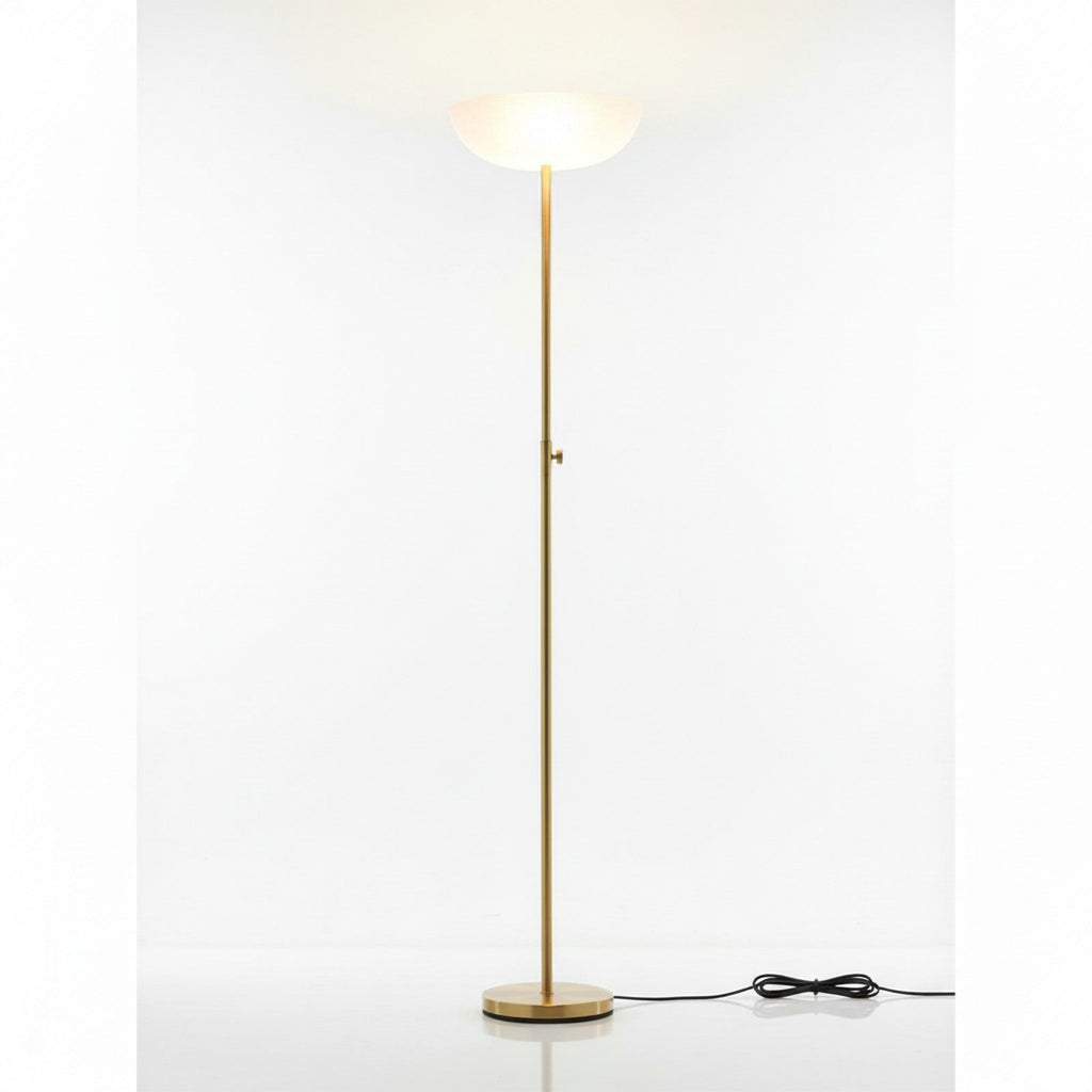 Brass torchiere floor lamp low angle looking up pole to frosted glass bowl shade
